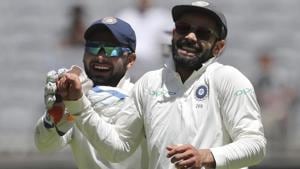 Rishabh Pant, left, and Virat Kohli share a laugh amid an Australian batting collapse during play in the second Test.(AP) Rishabh Pant, left, and Virat Kohli share a laugh amid an Australian batting collapse during play in the second Test.(AP)