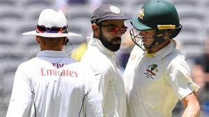 India's captain Virat Kohli (C) and Australia's captain Tim Paine react after Paine ran a single.(REUTERS) India's captain Virat Kohli (C) and Australia's captain Tim Paine react after Paine ran a single.(REUTERS)