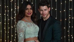 Priyanka Chopra and Nick Jonas during a reception in Mumbai, India. (Photo by PUNIT PARANJPE / AFP)(AFP) Priyanka Chopra and Nick Jonas during a reception in Mumbai, India. (Photo by PUNIT PARANJPE / AFP)(AFP)