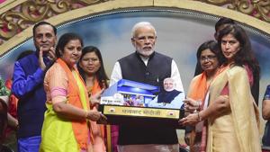 Prime Minister Narendra Modi being felicitated by BJP women's wing leaders during their National Convention, in Ahmedabad on December 22.(PTI Photo) Prime Minister Narendra Modi being felicitated by BJP women's wing leaders during their National Convention, in Ahmedabad on December 22.(PTI Photo)