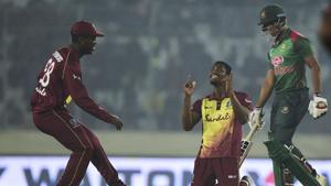 West Indies cricketer Keemo Paul (C) celebrates after the dismissal of Bangladeshi cricketer Mohammad Saifuddin (R) during the third Twenty20 (T20) cricket match(AFP) West Indies cricketer Keemo Paul (C) celebrates after the dismissal of Bangladeshi cricketer Mohammad Saifuddin (R) during the third Twenty20 (T20) cricket match(AFP)