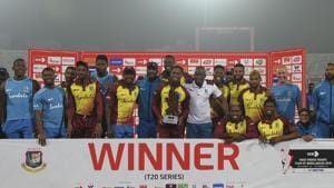 West Indies cricketers pose with the tournament trophy following the third Twenty20 (T20) cricket match between Bangladesh and West Indies at the Sher-e-Bangla National Cricket Stadium in Dhaka on December 22, 2018.(AFP) West Indies cricketers pose with the tournament trophy following the third Twenty20 (T20) cricket match between Bangladesh and West Indies at the Sher-e-Bangla National Cricket Stadium in Dhaka on December 22, 2018.(AFP)