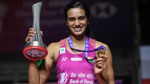 PV Sindhu poses with the trophy after the women's singles final match at the 2018 BWF World Tour Finals badminton competition.(AFP) PV Sindhu poses with the trophy after the women's singles final match at the 2018 BWF World Tour Finals badminton competition.(AFP)