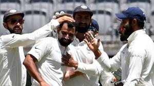 India's captain Virat Kohli (L) greets paceman Mohammed Shami (C) for his fifth wicket during day four of the second Test cricket match between Australia and India in Perth.(AFP) India's captain Virat Kohli (L) greets paceman Mohammed Shami (C) for his fifth wicket during day four of the second Test cricket match between Australia and India in Perth.(AFP)