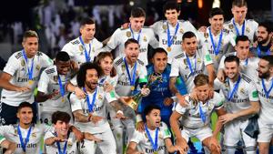 Real Madrid's players celebrate with the trophy after winning the FIFA Club World Cup final against Abu Dhabi's Al Ain.(AFP) Real Madrid's players celebrate with the trophy after winning the FIFA Club World Cup final against Abu Dhabi's Al Ain.(AFP)