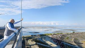 Prime Minister Narendra Modi waves at people from the Bogibeel Bridge, the longest rail-cum-road bridge on Brahmaputra river, after it was inaugurated by him, in Dibrugarh, Tuesday, Dec. 25, 2018. PM Modi also flagged off two new Intercity Express trains connecting Tinsukia and Naharlagun via the Bogibeel Bridge.(PTI) Prime Minister Narendra Modi waves at people from the Bogibeel Bridge, the longest rail-cum-road bridge on Brahmaputra river, after it was inaugurated by him, in Dibrugarh, Tuesday, Dec. 25, 2018. PM Modi also flagged off two new Intercity Express trains connecting Tinsukia and Naharlagun via the Bogibeel Bridge.(PTI)