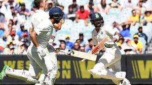 India's batsmen Virat Kohli and Cheteshwar Pujara run between the wickets during Day 1 of the third Test against Australia.(AFP) India's batsmen Virat Kohli and Cheteshwar Pujara run between the wickets during Day 1 of the third Test against Australia.(AFP)