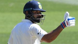 India's captain Virat Kohli reacts after reaching 50 runs on day two of the third test match between Australia and India at the MCG.(REUTERS) India's captain Virat Kohli reacts after reaching 50 runs on day two of the third test match between Australia and India at the MCG.(REUTERS)