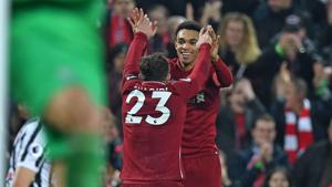 Liverpool's Swiss midfielder Xherdan Shaqiri (L) celebrates with Liverpool's English defender Trent Alexander-Arnold (R) after scoring their third goal during the English Premier League football match between Liverpool and Newcastle United at Anfield(AFP) Liverpool's Swiss midfielder Xherdan Shaqiri (L) celebrates with Liverpool's English defender Trent Alexander-Arnold (R) after scoring their third goal during the English Premier League football match between Liverpool and Newcastle United at Anfield(AFP)