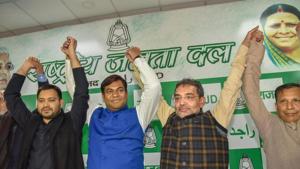 National president of the Vikasheel Insaan Party (VIP) Mukesh Sahni raises hands with RJD's leader Tejashwi Yadav and Rashtriya Lok Samta Party (RLSP) leader Upendra Kushwaha after joining the grand alliance during a press conference in Patna on December 23.(PTI Photo)