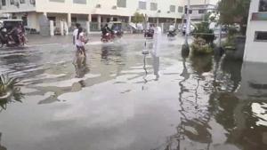 Pedestrians and vehicles move along a flooded street after a tropical depression descended upon Daet, Camarines Norte, the Philippines.(REUTERS) Pedestrians and vehicles move along a flooded street after a tropical depression descended upon Daet, Camarines Norte, the Philippines.(REUTERS)