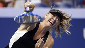 Maria Sharapova, of Russia, returns a shot to Carla Suarez Navarro, of Spain.(AP)