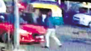 A CCTVfootage showed the accused drive off as the SPO clung on to the car. The video was shared widely on social media.(CCTV Grab) A CCTVfootage showed the accused drive off as the SPO clung on to the car. The video was shared widely on social media.(CCTV Grab)