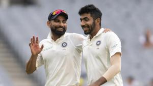 India's Mohammed Shami, left, speaks with Jasprit Bumrah during a Test match.(AP)