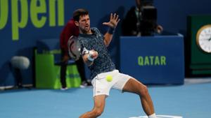 Serbia's Novak Djokovic in action during his first round match against Bosnia and Herzegovina's Damir Dzumhur in Qatar.(REUTERS) Serbia's Novak Djokovic in action during his first round match against Bosnia and Herzegovina's Damir Dzumhur in Qatar.(REUTERS)