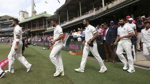 Virat Kohli, second left, leads his team out for a ceremony before their cricket test match against Australia in Sydney.(AP) Virat Kohli, second left, leads his team out for a ceremony before their cricket test match against Australia in Sydney.(AP)
