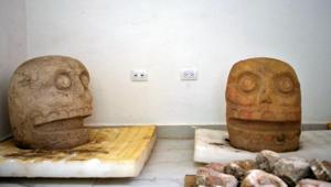 Handout picture released by Mexico's National Institute of Anthropology and History (INAH) taken on October 12, 2018 showing two sculptures dedicated to the pre-Hispanic fertility god Xipe Totec (The Flayed Lord).(AFP)