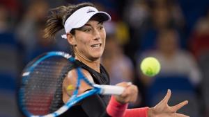 Garbine Muguruza of Spain hits a return against Katerina Siniakova of Czech Republic during their women's singles third round match of the WTA Wuhan Open tennis tournament in Wuhan on September 26, 2018.(AFP) Garbine Muguruza of Spain hits a return against Katerina Siniakova of Czech Republic during their women's singles third round match of the WTA Wuhan Open tennis tournament in Wuhan on September 26, 2018.(AFP)