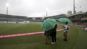 Rain falls before play on day 4 of the cricket test match between India and Australia in Sydney.(AP) Rain falls before play on day 4 of the cricket test match between India and Australia in Sydney.(AP)