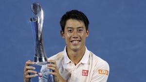 Kei Nishikori of Japan poses with the trophy.(AP)