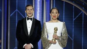 Host Sandra Oh holds her award for Best Actress - TV Series, Drama, Killing Eve while standing next to co-host Andy Samberg.(REUTERS) Host Sandra Oh holds her award for Best Actress - TV Series, Drama, Killing Eve while standing next to co-host Andy Samberg.(REUTERS)