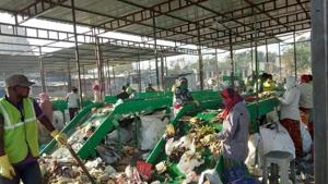 Garbage being segregated at the first commissioned plant which has a capacity of 16 tonnes.(HT Photo) Garbage being segregated at the first commissioned plant which has a capacity of 16 tonnes.(HT Photo)