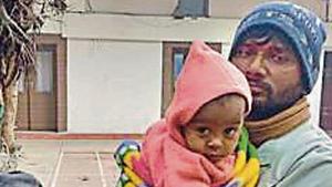 The nine-month-old boy with his parents. His parents said he had been abducted from a pavement in central Delhi.(HT Photo) The nine-month-old boy with his parents. His parents said he had been abducted from a pavement in central Delhi.(HT Photo)