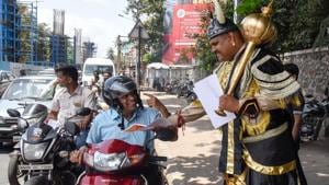 Metro worker dressed as Yamraj spreads awareness about road safety at Deccan corner in Pune.(Sanket Wankhade/HT PHOTO) Metro worker dressed as Yamraj spreads awareness about road safety at Deccan corner in Pune.(Sanket Wankhade/HT PHOTO)