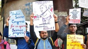 People hold placards to protest against claims made by speakers, discrediting theories of Isaac Newton and Albert Einstein, at the 106th Indian Science Congress, in Kolkata on January 7.(REUTERS) People hold placards to protest against claims made by speakers, discrediting theories of Isaac Newton and Albert Einstein, at the 106th Indian Science Congress, in Kolkata on January 7.(REUTERS)