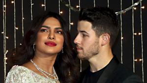 Bollywood actor Priyanka Chopra with husband-singer Nick Jonas pose for photos during their wedding reception, in Mumbai.(PTI) Bollywood actor Priyanka Chopra with husband-singer Nick Jonas pose for photos during their wedding reception, in Mumbai.(PTI)