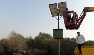 Officials check CCTV cameras installed near mangroves in Vashi along the Sion-Panvel Highway on experimental-basis.(Bachchan Kumar/HT) Officials check CCTV cameras installed near mangroves in Vashi along the Sion-Panvel Highway on experimental-basis.(Bachchan Kumar/HT)