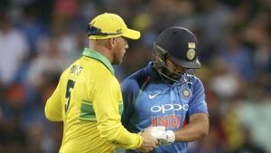 Australia's Aaron Finch, left, shakes hands with India's Rohit Sharma, right, after he was caught out against during their one day international cricket match in Sydney(AP) Australia's Aaron Finch, left, shakes hands with India's Rohit Sharma, right, after he was caught out against during their one day international cricket match in Sydney(AP)
