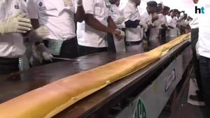 <p>Sixty chefs from a private restaurant have made what they claim is the world's longest dosa. A dosa is a type of pancake which forms an important part of southern Indian and Sri Lankan cuisine. The impressive creation was coordinated by chef Dr Vinoth Kumar in Chennai in the Indian state of Tamil Nadu on Friday.</p><p>The 100-foot dosa was make using a staggering 37.5 kilos of butter and had to be prepared in a 105-foot pan</p>