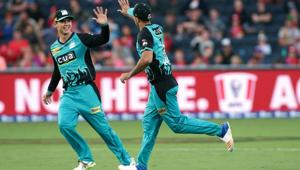 Josh Lalor of the Brisbane Heat celebrates his catch with a high five from Mitch Swepson.(Getty Images) Josh Lalor of the Brisbane Heat celebrates his catch with a high five from Mitch Swepson.(Getty Images)