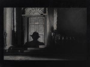 The paintings are in stark tones of black and white and have a grainy feel to them, making them look like film stills. The paintings are in stark tones of black and white and have a grainy feel to them, making them look like film stills.