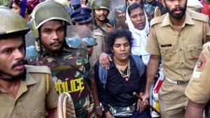 In the file photo, Kanaka Durga, 44, are escorted by police after she attempted to enter the Sabarimala temple in Pathanamthitta district in the southern state of Kerala, India, December 24, 2018. Picture taken December 24, 2018.(REUTERS)