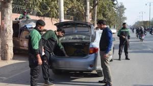 Pakistani police officers check a vehicle as security is beefed up in the eastern city of Faisalabad, Pakistan.(AP Photo) Pakistani police officers check a vehicle as security is beefed up in the eastern city of Faisalabad, Pakistan.(AP Photo)