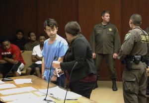 Yu Wei Gong, left, speaks to Deputy Public Defender Diamond Grace in court in Honolulu. Gong, the man who admitted to killing and dismembering his mother during an argument in their Honolulu apartment, was sentenced Monday.(AP) Yu Wei Gong, left, speaks to Deputy Public Defender Diamond Grace in court in Honolulu. Gong, the man who admitted to killing and dismembering his mother during an argument in their Honolulu apartment, was sentenced Monday.(AP)