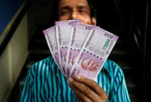The rupee opened on a weaker note but soon pared the losses and appreciated by 13 paise to 70.92 against the US dollar in opening trade Wednesday.(REUTERS) The rupee opened on a weaker note but soon pared the losses and appreciated by 13 paise to 70.92 against the US dollar in opening trade Wednesday.(REUTERS)