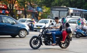 A man driving the bike without helmet in Kothrud.(HT/PHOTO)
