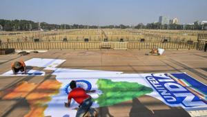 Workers prepare a mural on the dais during preparations ahead of opposition rally at Brigade Parade Ground in Kolkata.(AP) Workers prepare a mural on the dais during preparations ahead of opposition rally at Brigade Parade Ground in Kolkata.(AP)