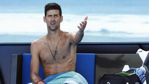 Novak Djokovic gestures during a break in the match against Canada’s Denis Shapovalov at the Australian Open.(REUTERS) Novak Djokovic gestures during a break in the match against Canada’s Denis Shapovalov at the Australian Open.(REUTERS)