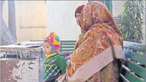 The woman’s family members wait to receive the body inside the mortuary on Friday.(HT Photo) The woman’s family members wait to receive the body inside the mortuary on Friday.(HT Photo)