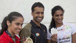 File image of PV Sindhu, right, and Saina Nehwal, left, with their coach Pullela Gopichand.(AP) File image of PV Sindhu, right, and Saina Nehwal, left, with their coach Pullela Gopichand.(AP)