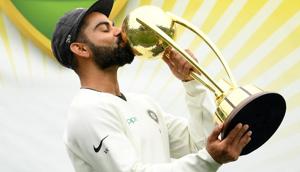 India's captain Virat Kohli kisses the Border-Gavaskar Trophy as they celebrate a 2-1 series victory over Australia(REUTERS) India's captain Virat Kohli kisses the Border-Gavaskar Trophy as they celebrate a 2-1 series victory over Australia(REUTERS)
