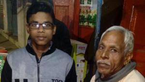 Shiv Kumar Prasad Chaurasia with his son Shubham who crack JEE Main(Anil Kumar Ojha/Hindustan Times) Shiv Kumar Prasad Chaurasia with his son Shubham who crack JEE Main(Anil Kumar Ojha/Hindustan Times)
