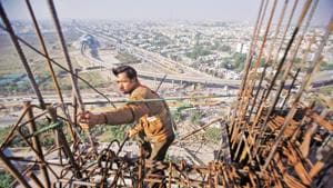 A labourer works at the construction of a residential complex at Noida.(REUTERS) A labourer works at the construction of a residential complex at Noida.(REUTERS)