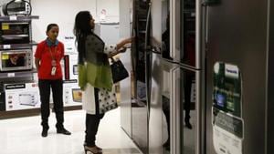 A customer inspects a refrigerator on display at a store in Mumbai.(Bloomberg)