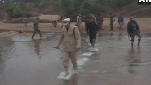 Police and District Administration officials of a village in Bastar waded through water to hoist the Tricolour on the banks of river Indravati.(ANI Photo/Twitter) Police and District Administration officials of a village in Bastar waded through water to hoist the Tricolour on the banks of river Indravati.(ANI Photo/Twitter)