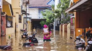 At least 68 people have been killed and thousands were forced to flee their homes after floods and landslides hit the island of Sulawesi, Indonesia.(AP) At least 68 people have been killed and thousands were forced to flee their homes after floods and landslides hit the island of Sulawesi, Indonesia.(AP)